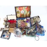 A collection of costume jewellery including vintage necklaces, beads, mother of pearl box, wooden