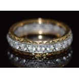An 18ct gold eternity ring set with paste, 4.6g, size N/O