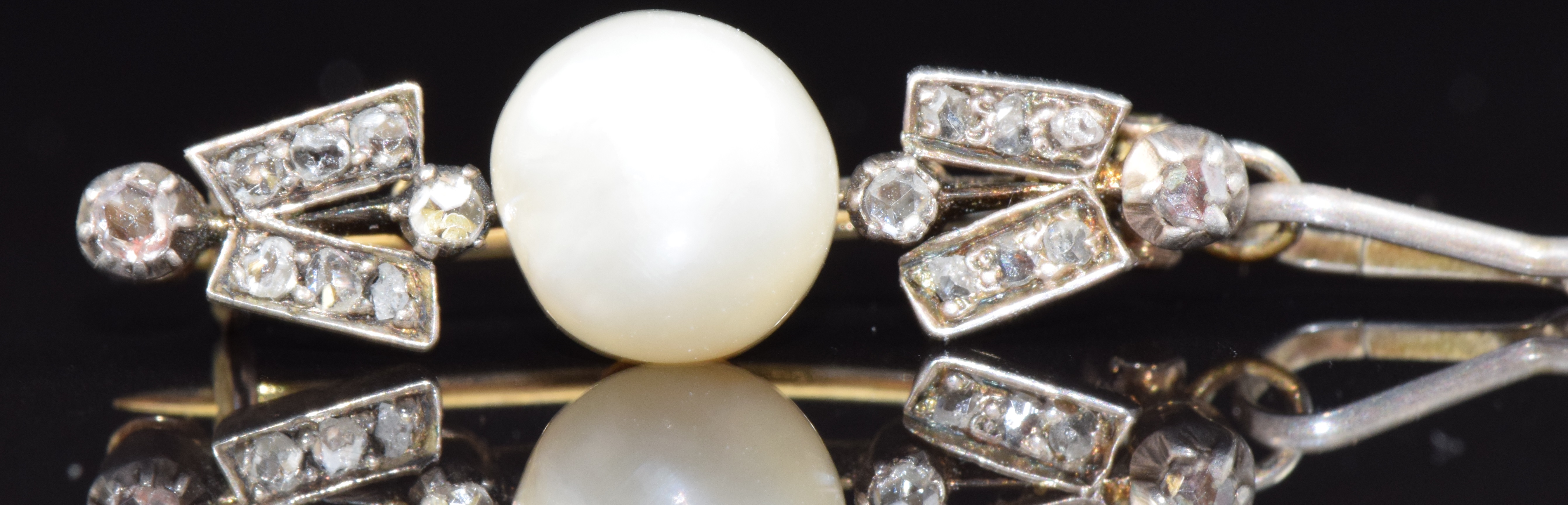 A late Victorian brooch set with a natural pearl and diamonds, 2.3g, 2.5cm long - Image 2 of 3