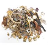 A collection of costume jewellery including chains, necklaces, watches, brooches, etc
