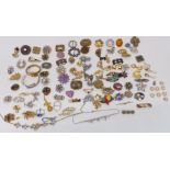 A collection of vintage brooches including enamel, paste, etc