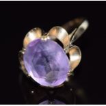 A 9ct gold ring set with an oval cut amethyst, 3.3g, size P