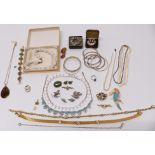 A collection of costume jewellery including pearl necklace, silver bangle, silver brooch depicting a