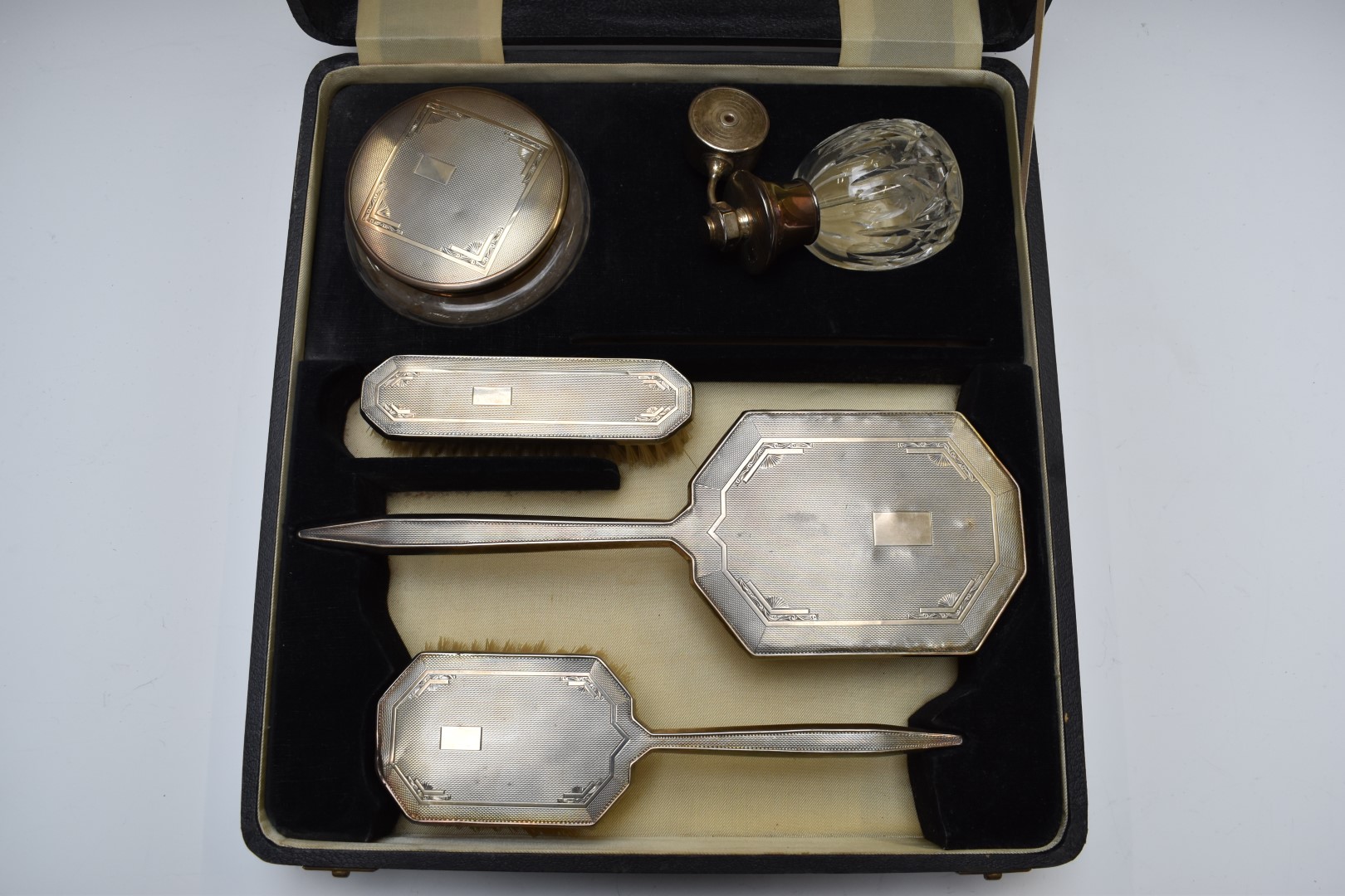 Cased Art Deco hallmarked silver mounted dressing table set comprising hand mirror, two brushes - Image 2 of 5