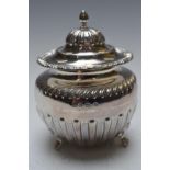 Edward VII hallmarked silver tea caddy with hinged lid raised on lion paw feet, Birmingham 1905,