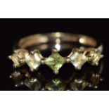 A 9ct gold ring set with peridot, 1.7g, size O
