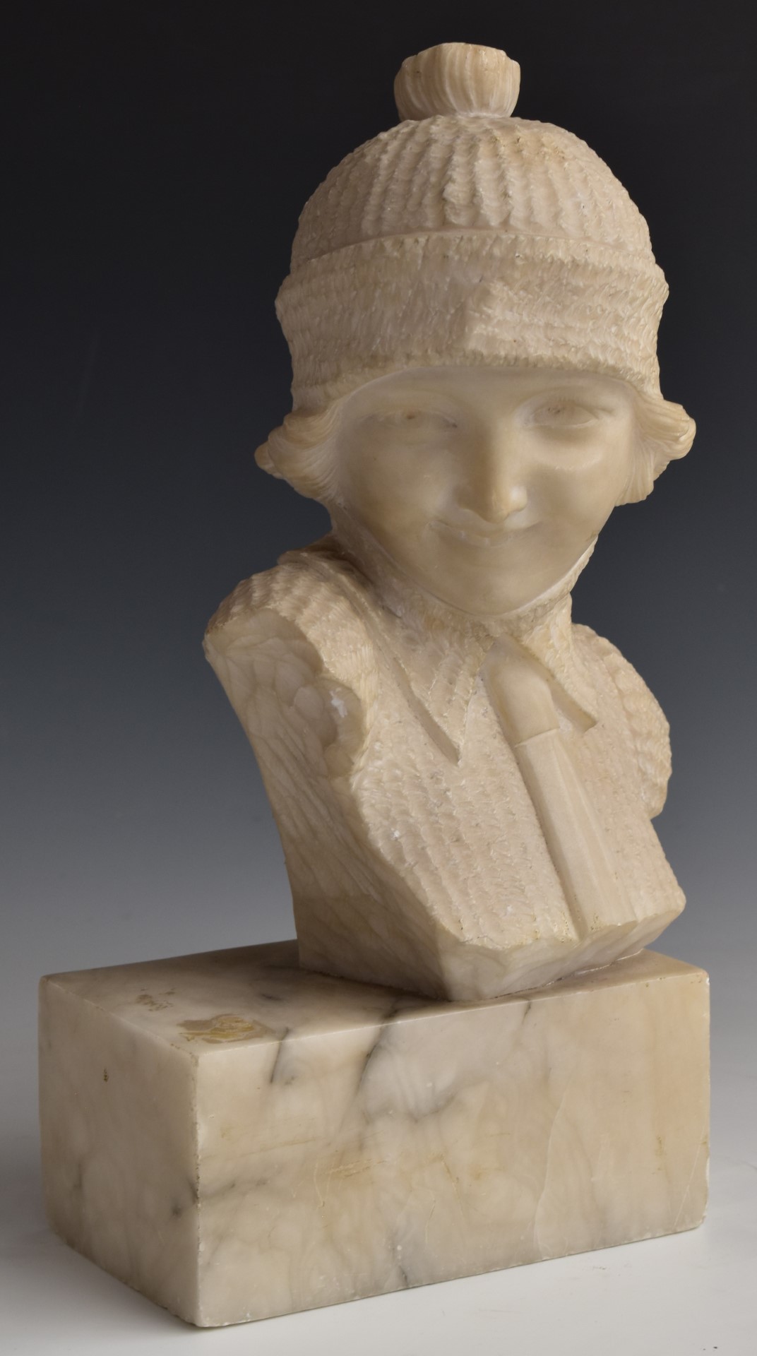 Austrian or similar early 20thC carved alabaster study of a young lady in jumper and hat,