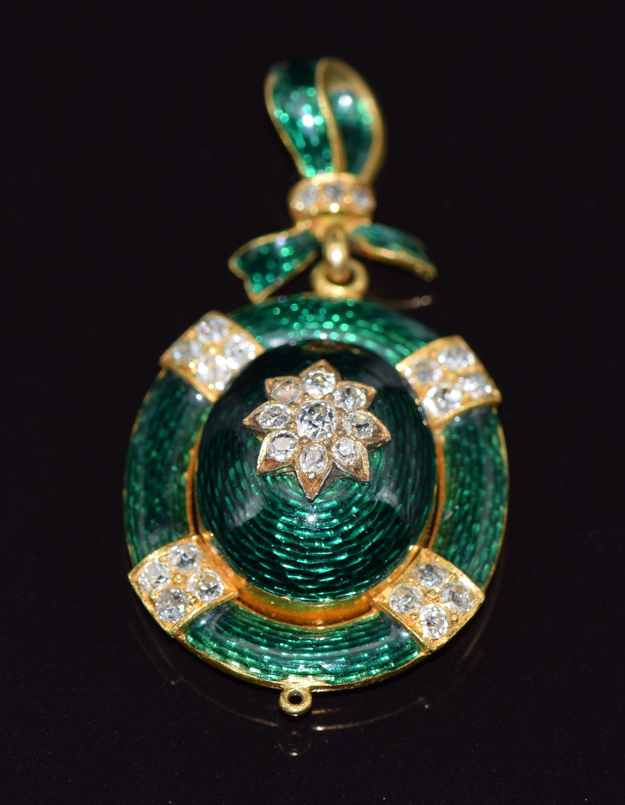 Victorian gold pendant/ locket set with green guilloché enamel and old cut diamonds, verso a glass