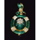 Victorian gold pendant/ locket set with green guilloché enamel and old cut diamonds, verso a glass
