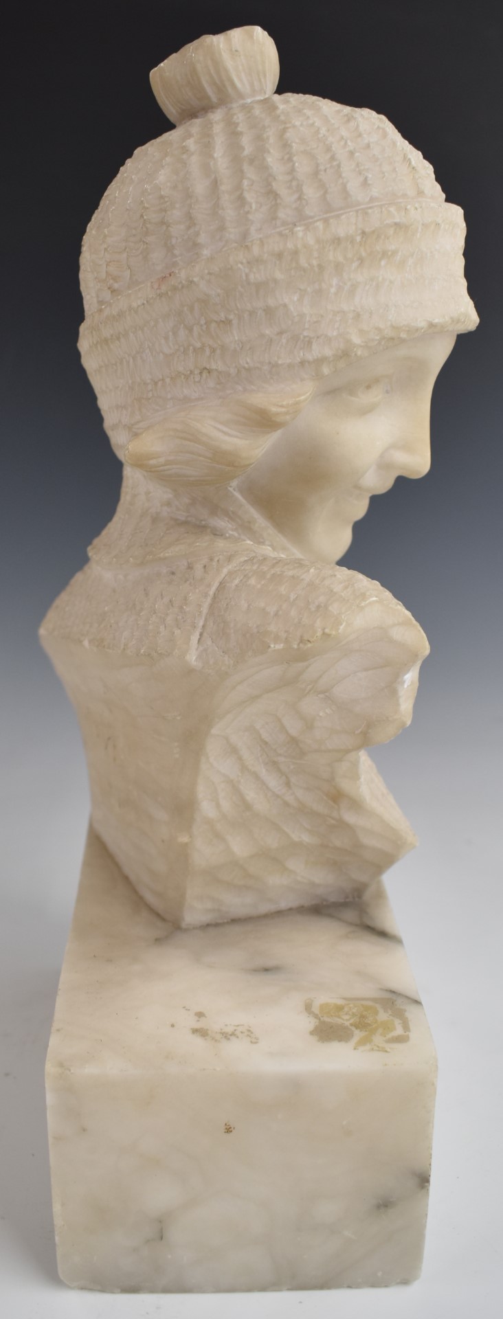 Austrian or similar early 20thC carved alabaster study of a young lady in jumper and hat, - Image 5 of 5