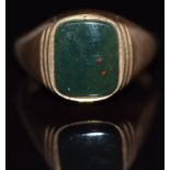 A 9ct gold ring set with a bloodstone, 6.6g. size V
