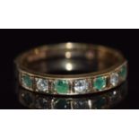 A 9ct gold half eternity ring set with round cut emeralds and diamonds, 1.5g, size I