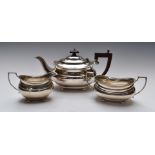 George VI hallmarked silver three piece tea set with gadrooned edge, raised on ball feet, Birmingham