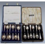 Two cased sets of six hallmarked silver tea or coffee spoons, one with shell top design, weight