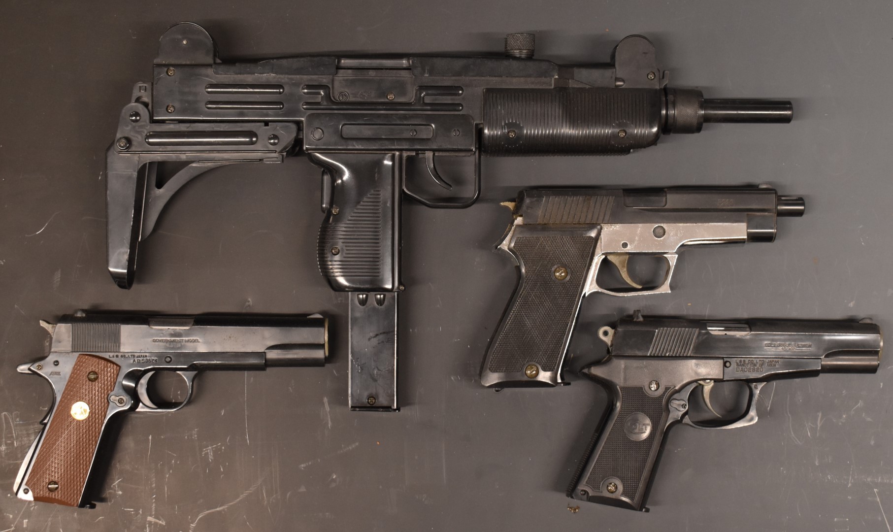 Four ASGK and L&S Co BB airsoft pistols comprising SMG Uzi, Colt Mk IV, Colt Double Eagle and Sig