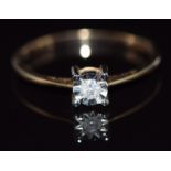 A 9ct gold ring set with a diamond in an illusion setting, 1.2g, size O