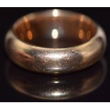 A yellow metal wedding band/ ring, 8.7g, size J
