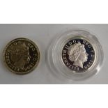 1998 £1 coins comprising a silver piedfort and a standard issue, early strikes produced for the
