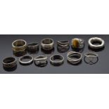 Twelve silver rings including one set with tiger's eye, 43g