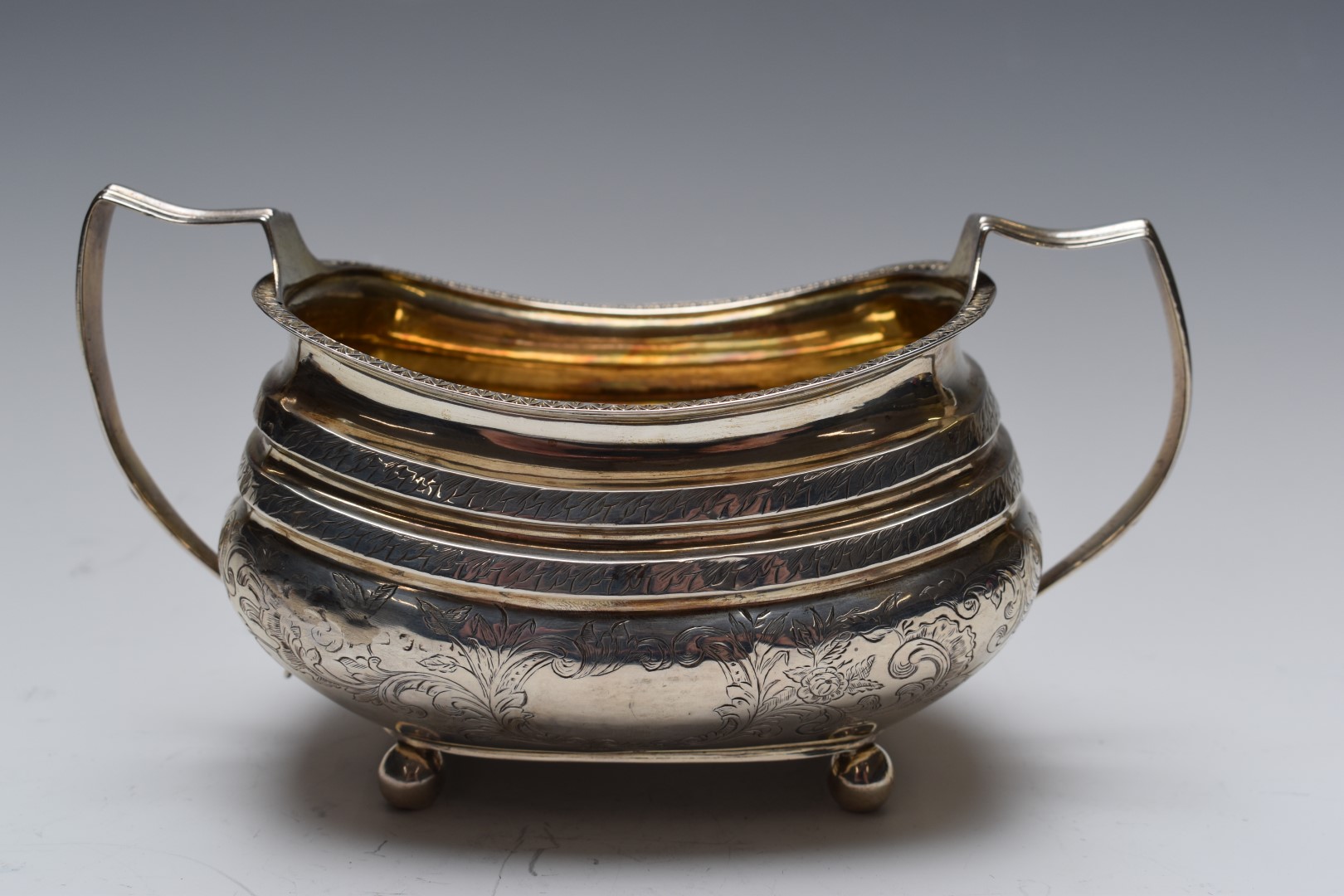 Georgian white metal sugar bowl with gilt wash interior, engraved decoration and twin handles, width - Image 2 of 3