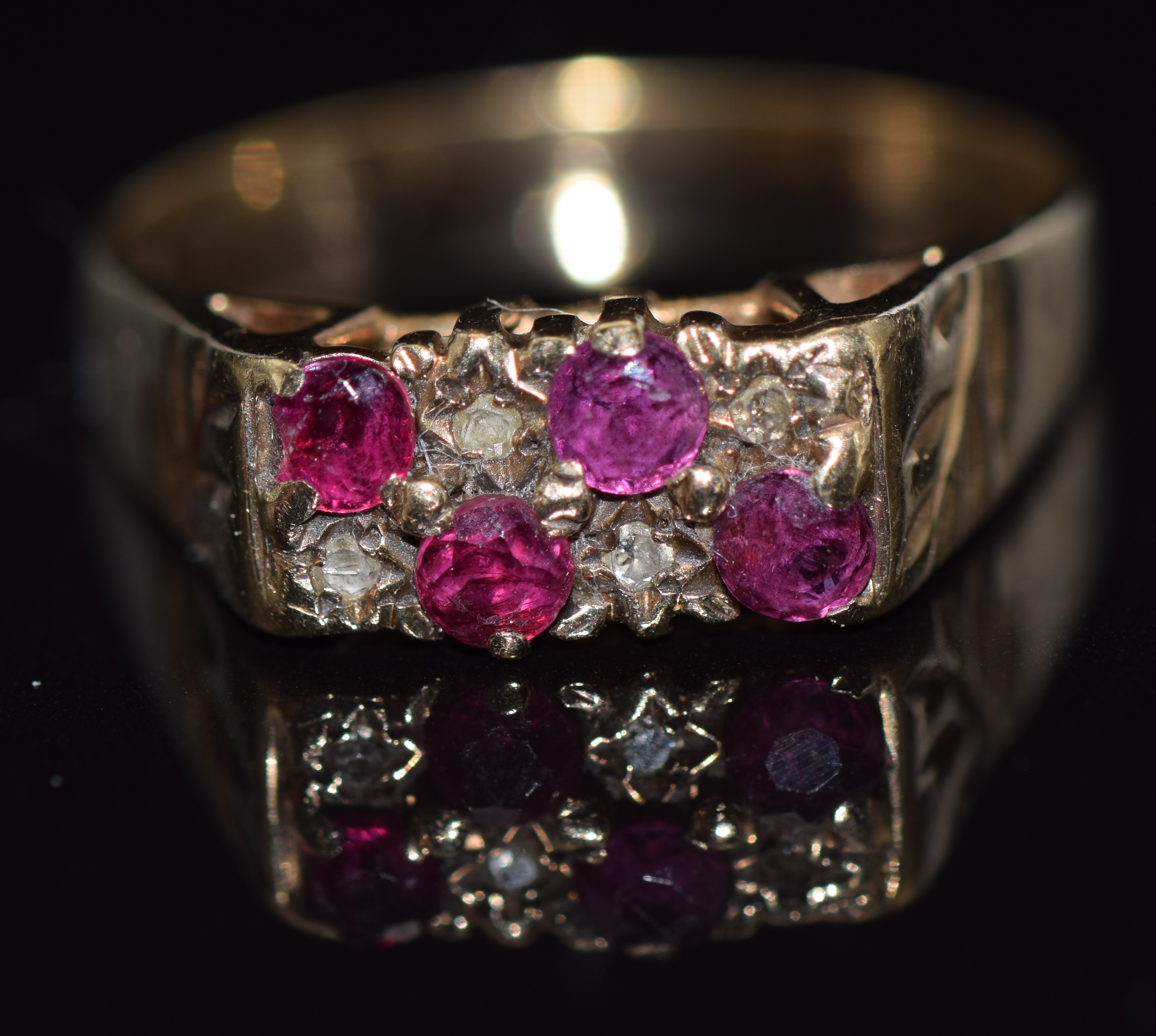 A 9ct gold ring set with rubies and diamonds,3.2g, size R