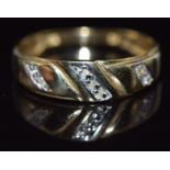 A 9ct gold ring set with diamonds, 1.2g, size N