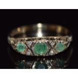 A 9ct gold ring set with emeralds and diamonds, 2.5g, size L