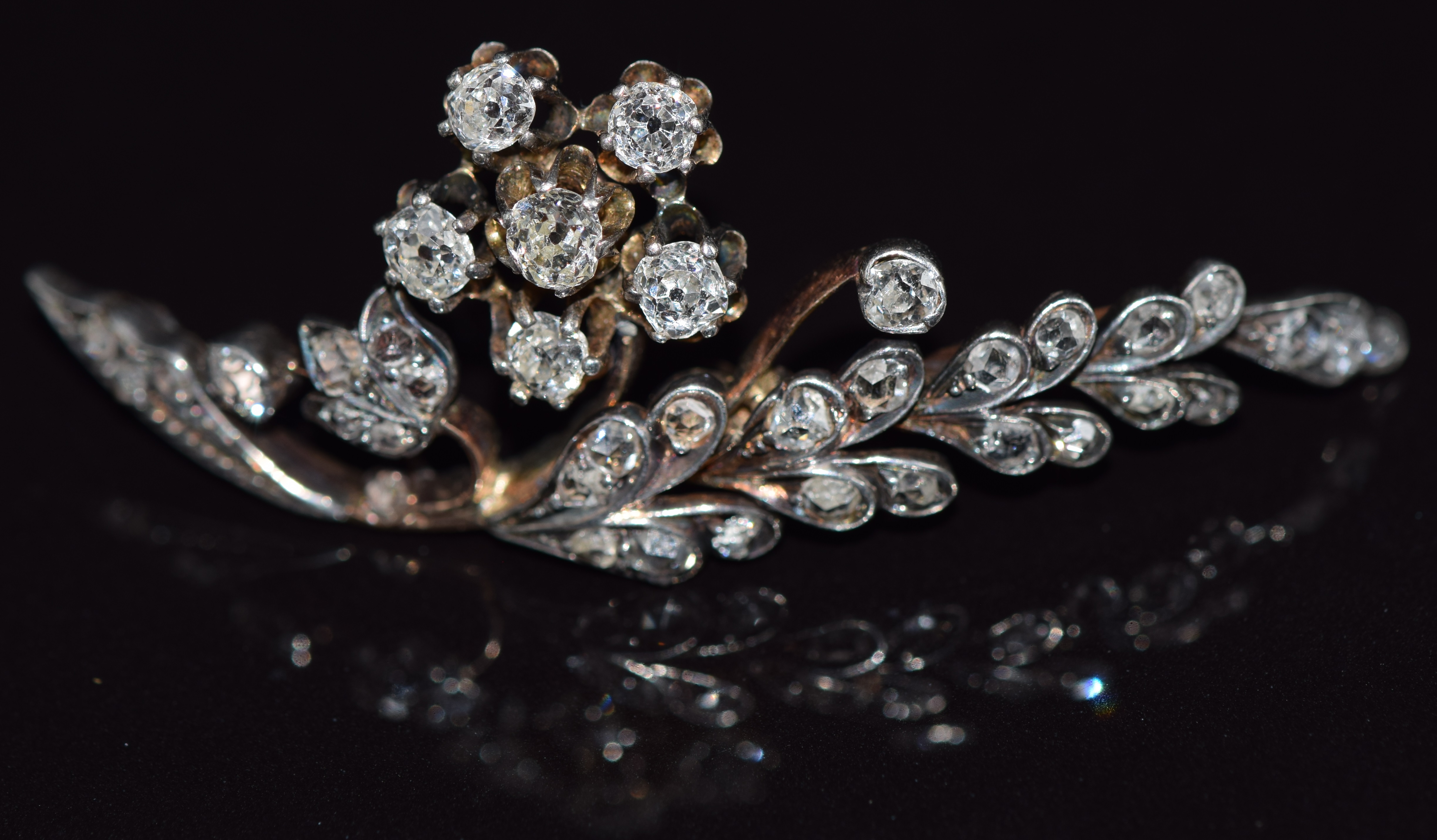 Victorian brooch set with old cut diamonds in a floral and foliate design, 5cm long, 5.5g