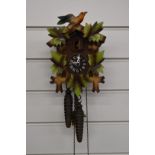 A c1970s two train cuckoo clock in painted case, with two weights, H22cm