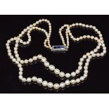 Two strand pearl necklace (mixture of cultured and natural pearls) with a white gold clasp set