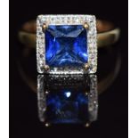 A 9ct gold ring set with a square cut synthetic sapphire and diamonds, 3.8g, size O/P