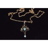 A 9ct gold necklace and an Edwardian pendant set with an oval aquamarine, 4.6g