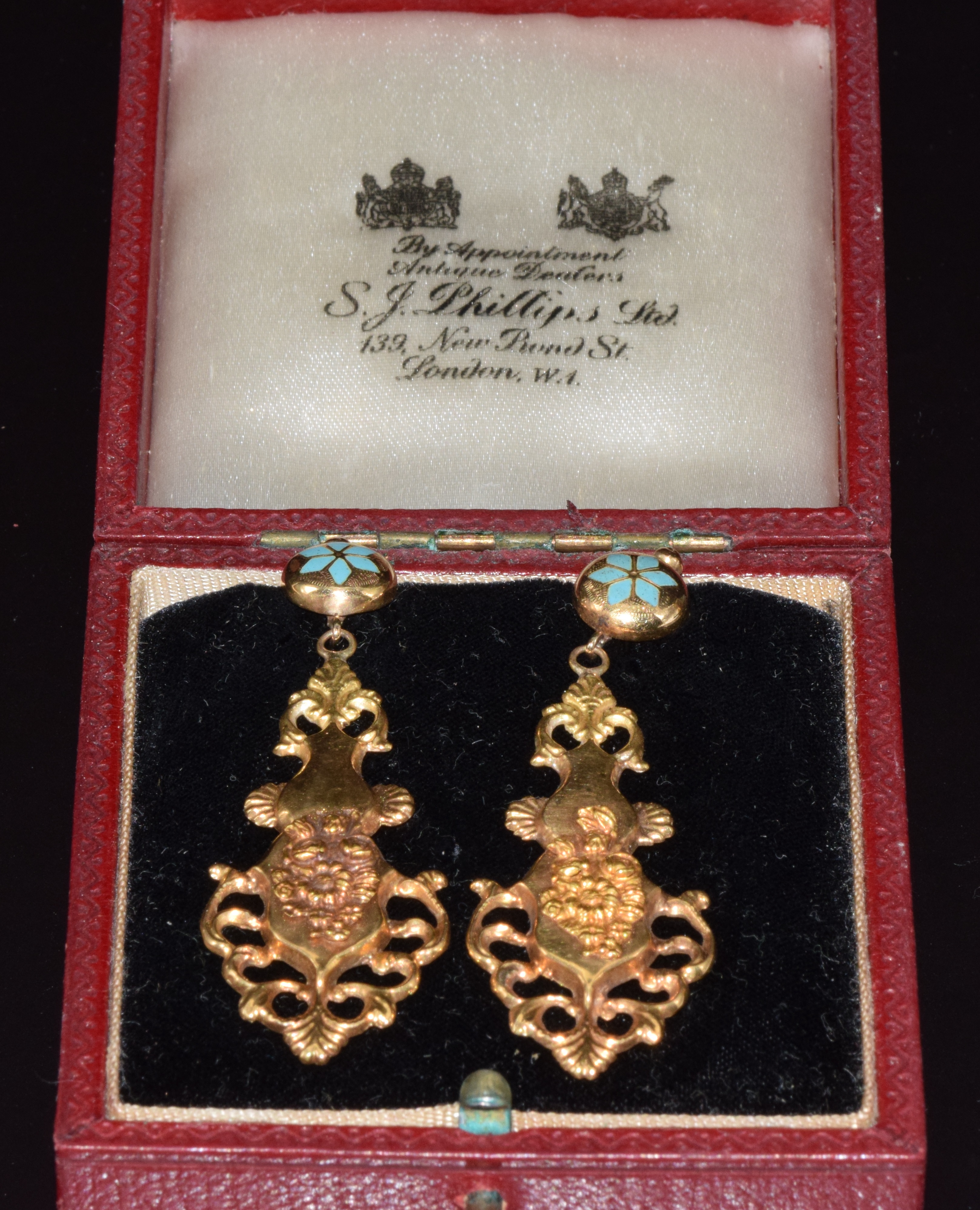 A pair of yellow metal earrings set with enamel and with embossed floral decoration, 4.6g - Image 2 of 2