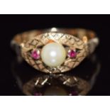 A 9ct gold ring set with a pearl and rubies, 2.4g, size O/P