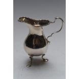 George V hallmarked silver milk jug, raised on three feet, London 1920, maker Charles Edwards,