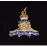 A 9ct gold Royal Artillery charm/ pendant set with enamel, 1.9g