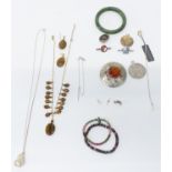 A collection of jewellery including silver, brooch, tiger's eye necklace, nephrite jade bangle, etc