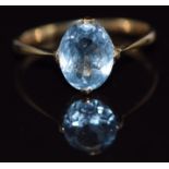A 9ct gold ring set with an oval cut blue topaz, 1.4g, size L/M
