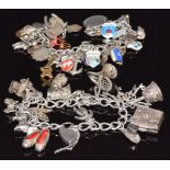 Two silver charm bracelets including enamel charms, anchor, boat, dog, car, etc, 154g