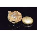 A 9ct gold 35 years service shell badge (3.4g) and a gold nugget (4.8g)