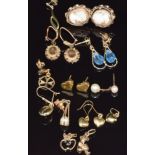 A collection of 9ct gold earrings including heart shape, cameo set, etc, 11.7g