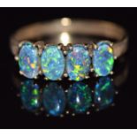 A 9ct gold ring set with four opal triplets, 2.1g, size O