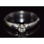 A 9ct white gold ring set with a round cut diamond of approximately 0.2ct, 2.6g, size L