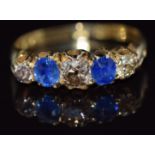 Edwardian 18ct gold ring set with diamonds and sapphires, the central diamond approximately 0.