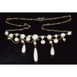 A c1900 9ct gold necklace set with round cut opal cabochons and teardrop opals, 6.5g, 44cm long