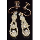 A pair of Victorian earrings set with pearls