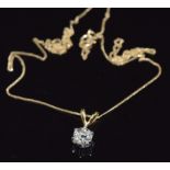 An 18ct gold pendant set with an old cut diamond of approximately 0.6ct, on 9ct gold chain, 1.5g