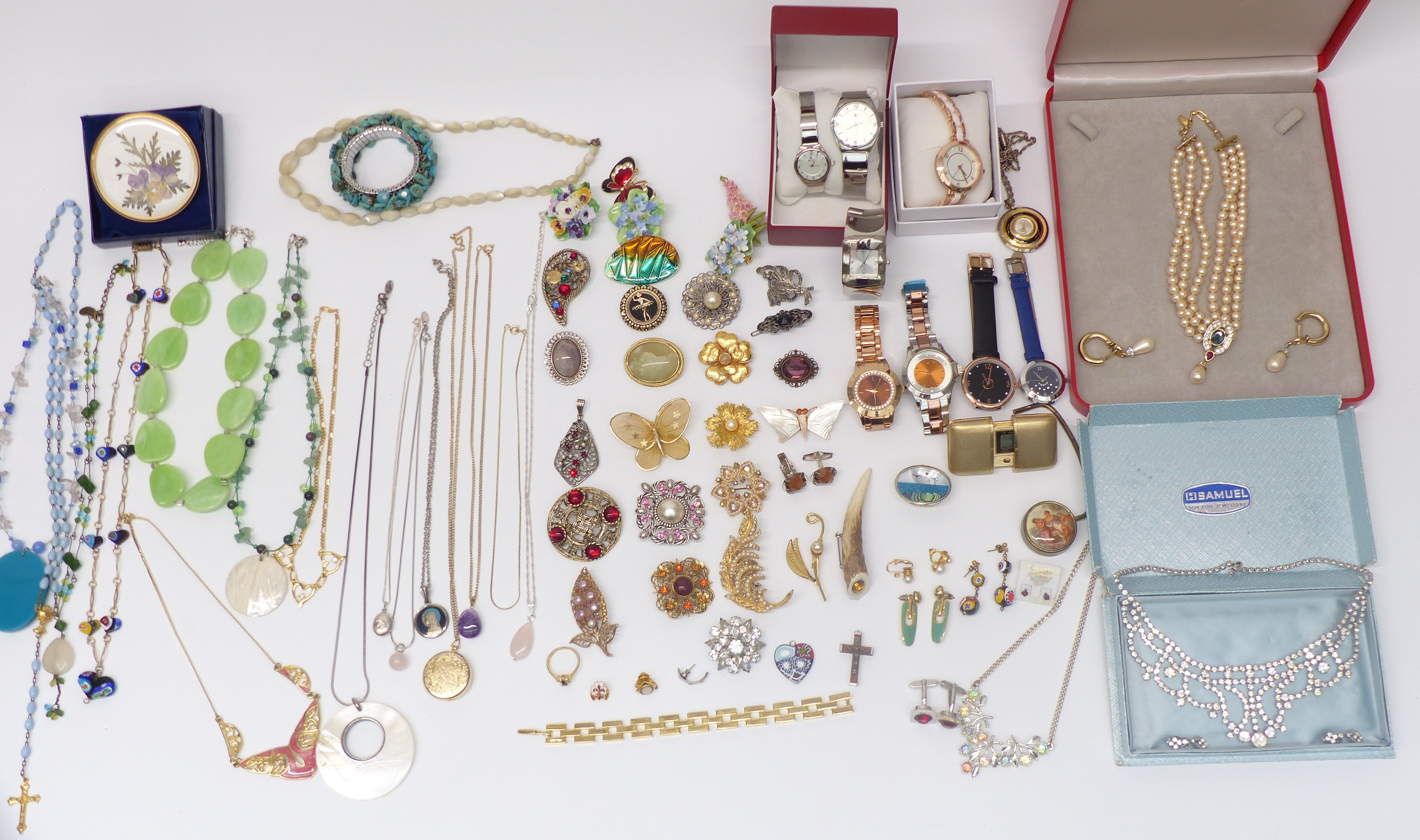 A collection of costume jewellery including Ciro, silver locket, vintage brooches, Raymond Weil
