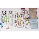 A collection of costume jewellery including Ciro, silver locket, vintage brooches, Raymond Weil