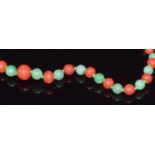 A jadeite and coral beaded necklace, 48cm long